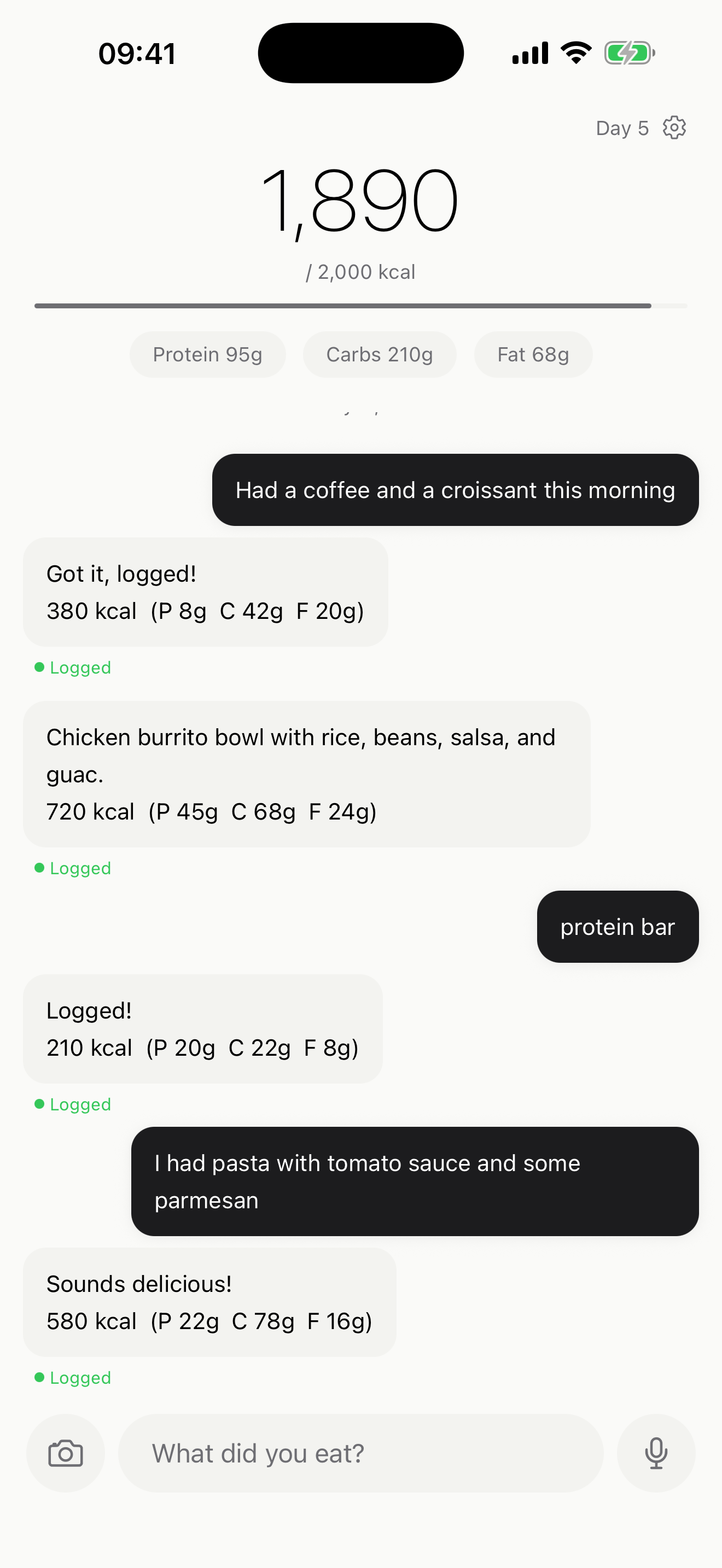Main screen showing logged food entries with calorie and macro totals
